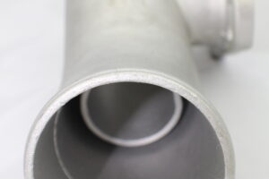 A close up of the pipe on top of a white table