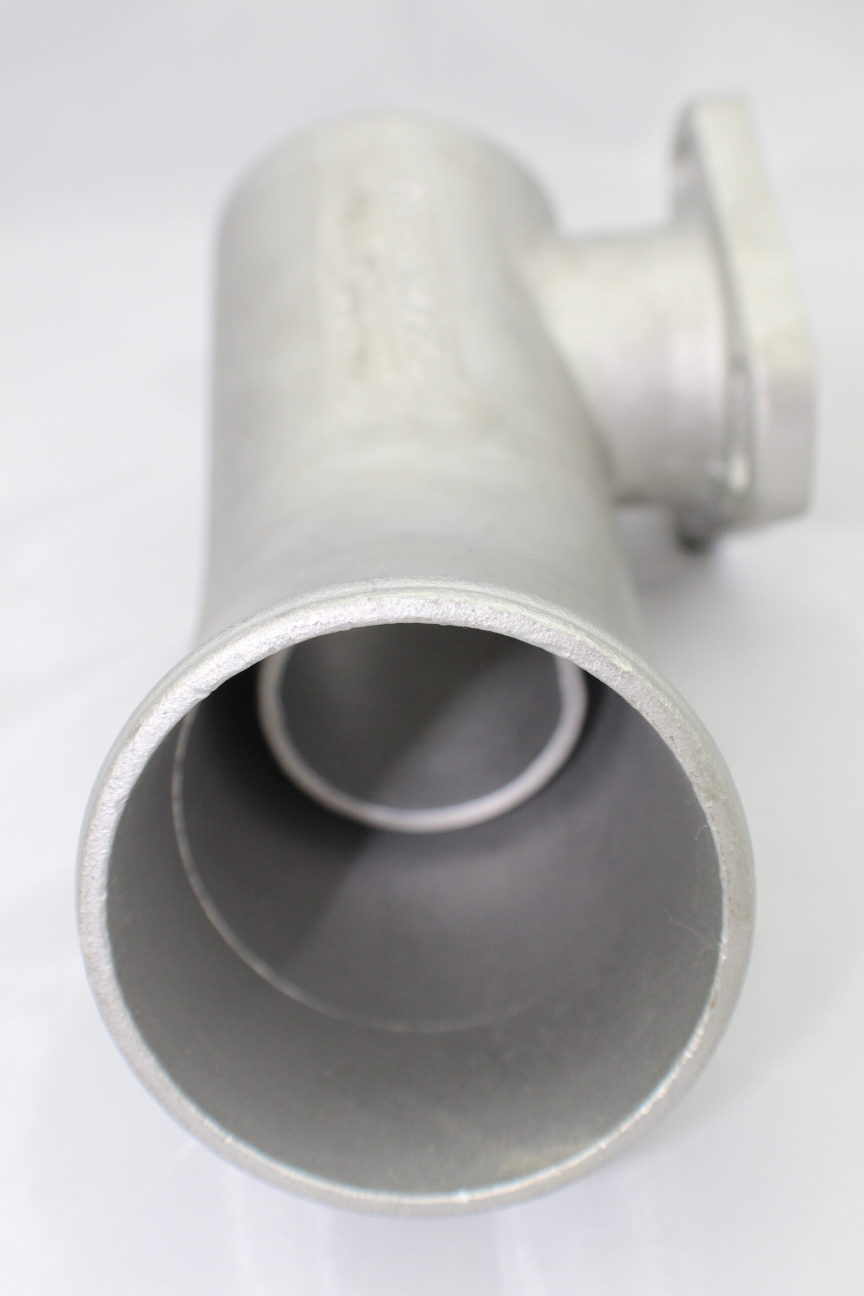 A close up of the pipe on top of a white table