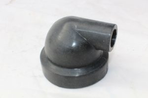 A black plastic pipe sitting on top of a table.