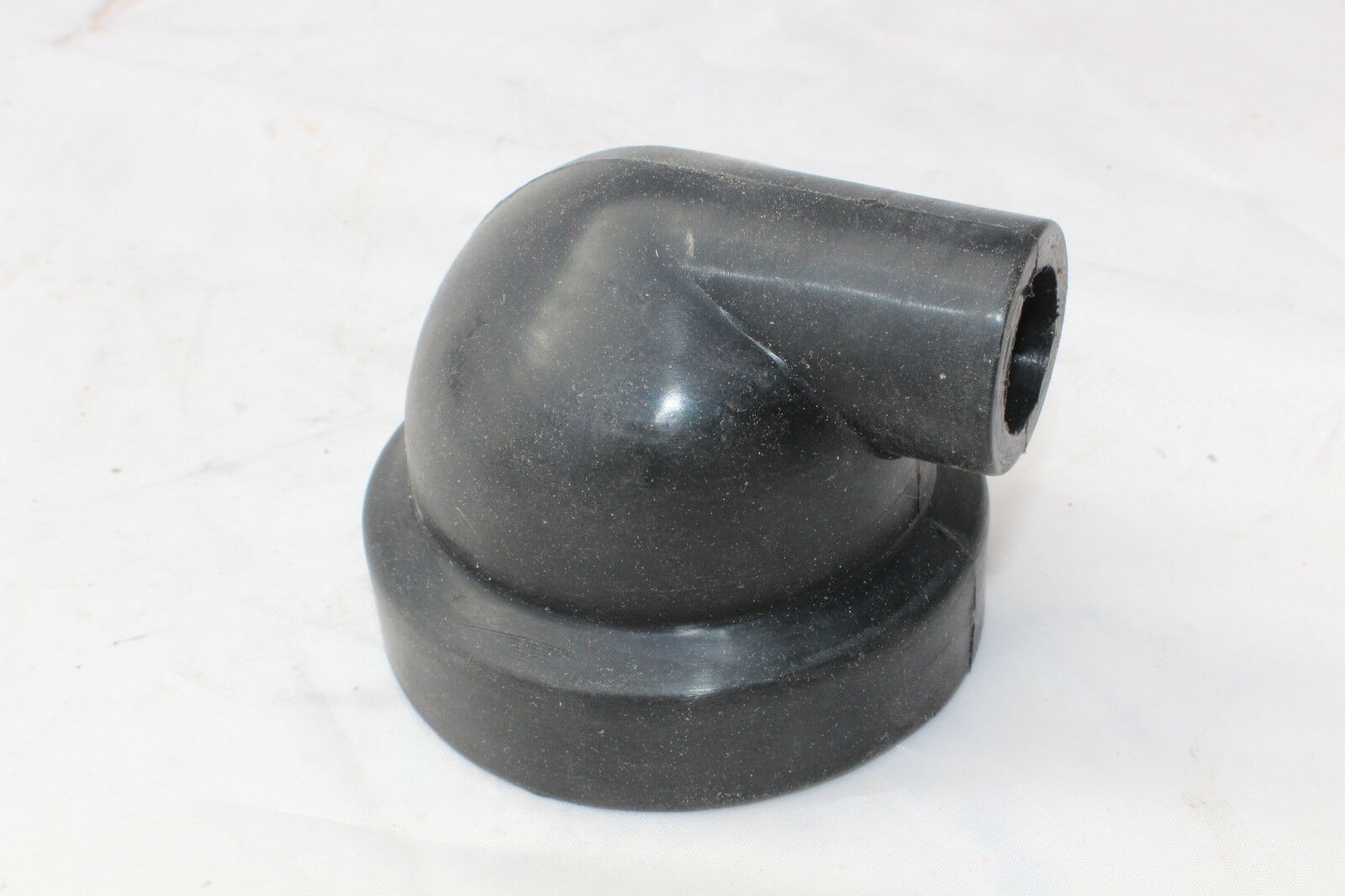 A black plastic pipe sitting on top of a table.