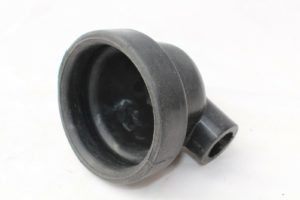 A black plastic pipe with a hole in the middle.