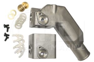 A pair of metal parts with some white plastic and brass hardware.