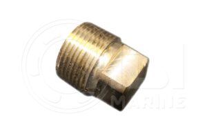 A brass pipe fitting that is sitting on the ground.