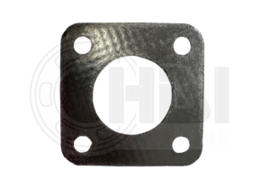 A black gasket that is sitting on the ground.