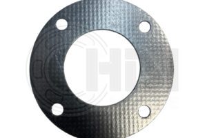 A metal gasket that is sitting on the ground.